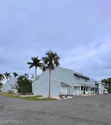 15 Watercolor Way, Unit 15 Naples, FL 34113 - Photo 24 of 29 a view of houses with a street