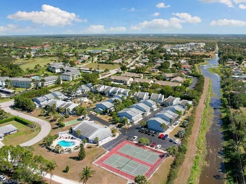 15 Watercolor Way, Unit 15 Naples, FL 34113 - Photo 26 of 29 an aerial view of residential houses with outdoor space