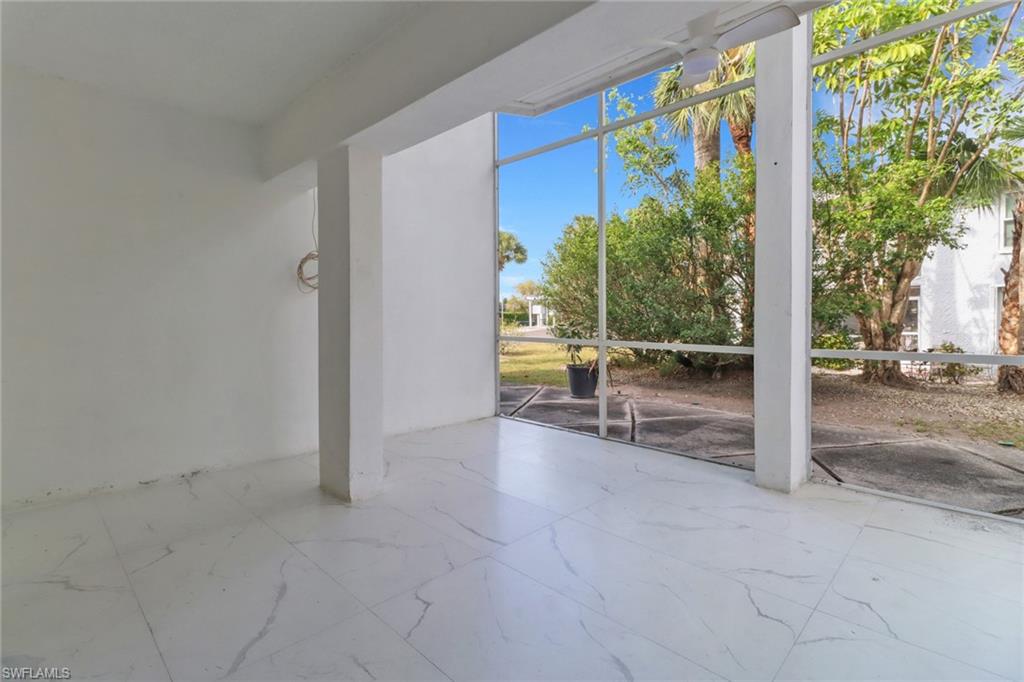 15 Watercolor Way, Unit 15 Naples, FL 34113 - Photo 10 of 29 a view of an outdoor space with porch