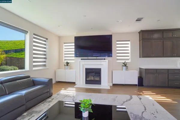 a large kitchen with kitchen island a island a sink stainless steel appliances and cabinets