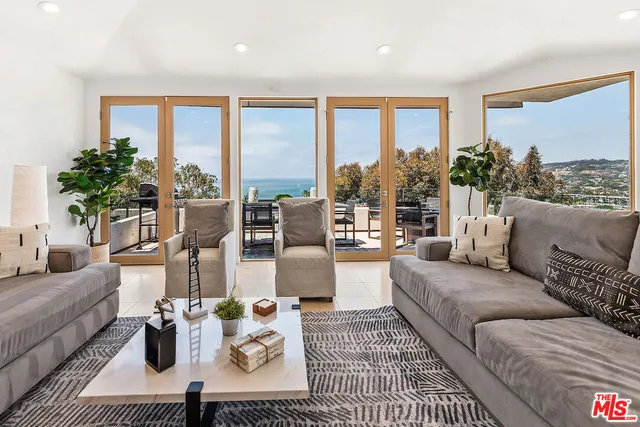 a kitchen with stainless steel appliances kitchen island granite countertop a sink and cabinets