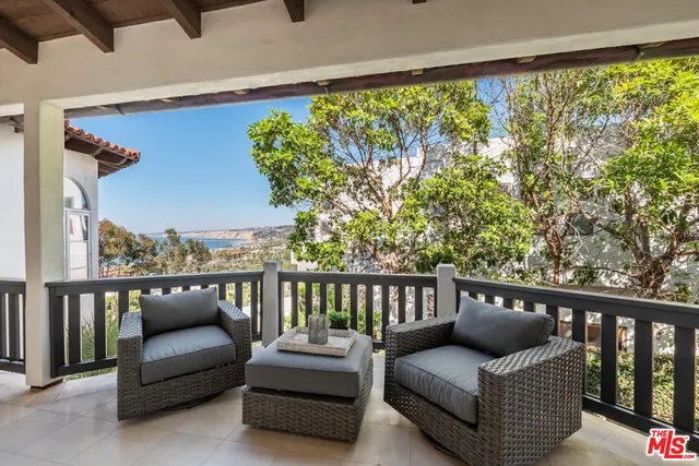 a view of a dining room with furniture and a window