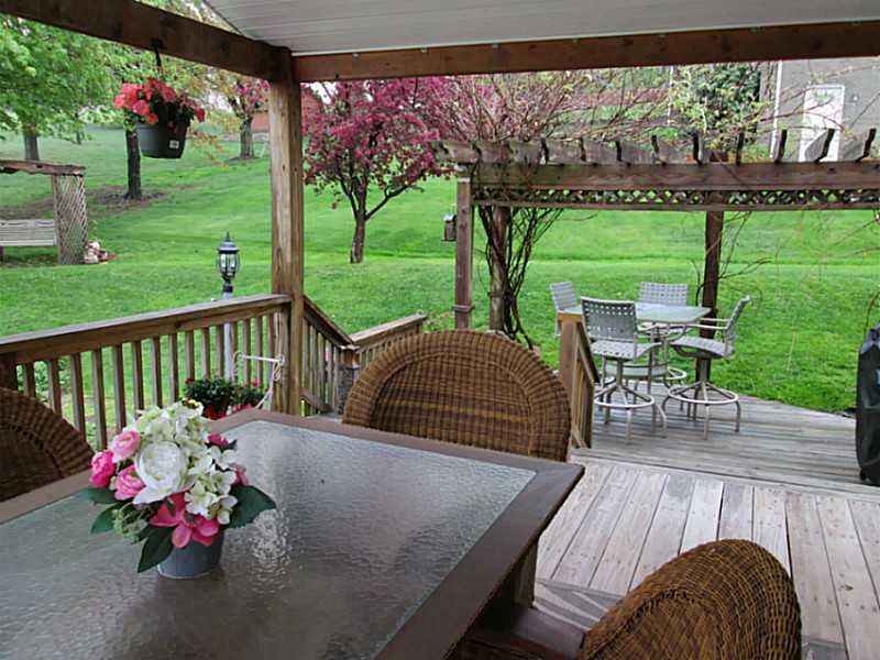 6938 Mellon Road Export, PA 15632 - Photo 23 of 24 Exterior Back. COVERED DECK OVERLOOKING PRIVATE YARD