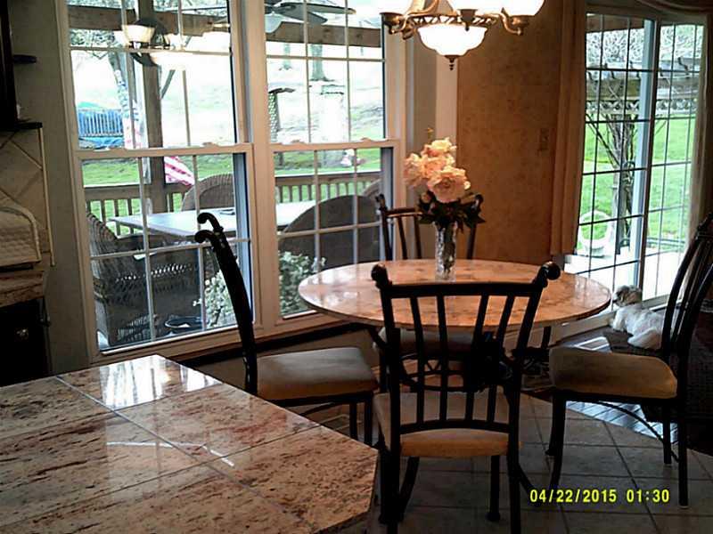 6938 Mellon Road Export, PA 15632 - Photo 5 of 24 Kitchen. BRIGHT AND CHEERFUL EAT-IN KITCHEN HAS VIEW OF DECK AND 1 ACRE LOT