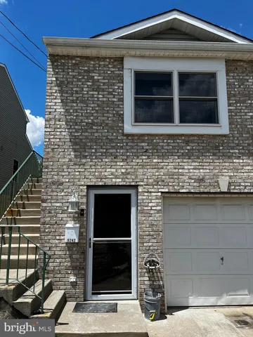 a front view of a house with garage