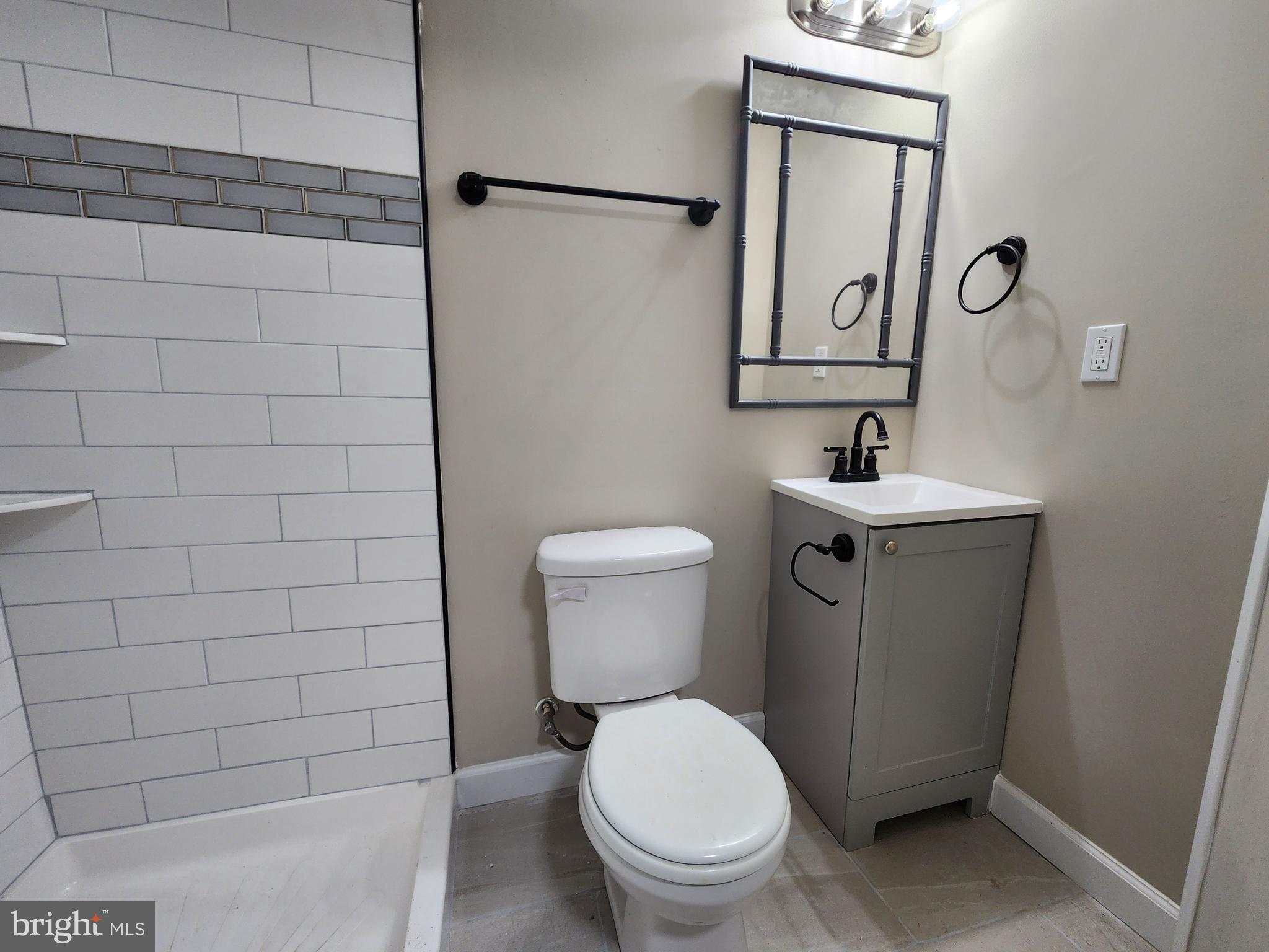 1925 Ewald Avenue Baltimore, MD 21222 - Photo 20 of 29 a bathroom with a toilet sink and mirror