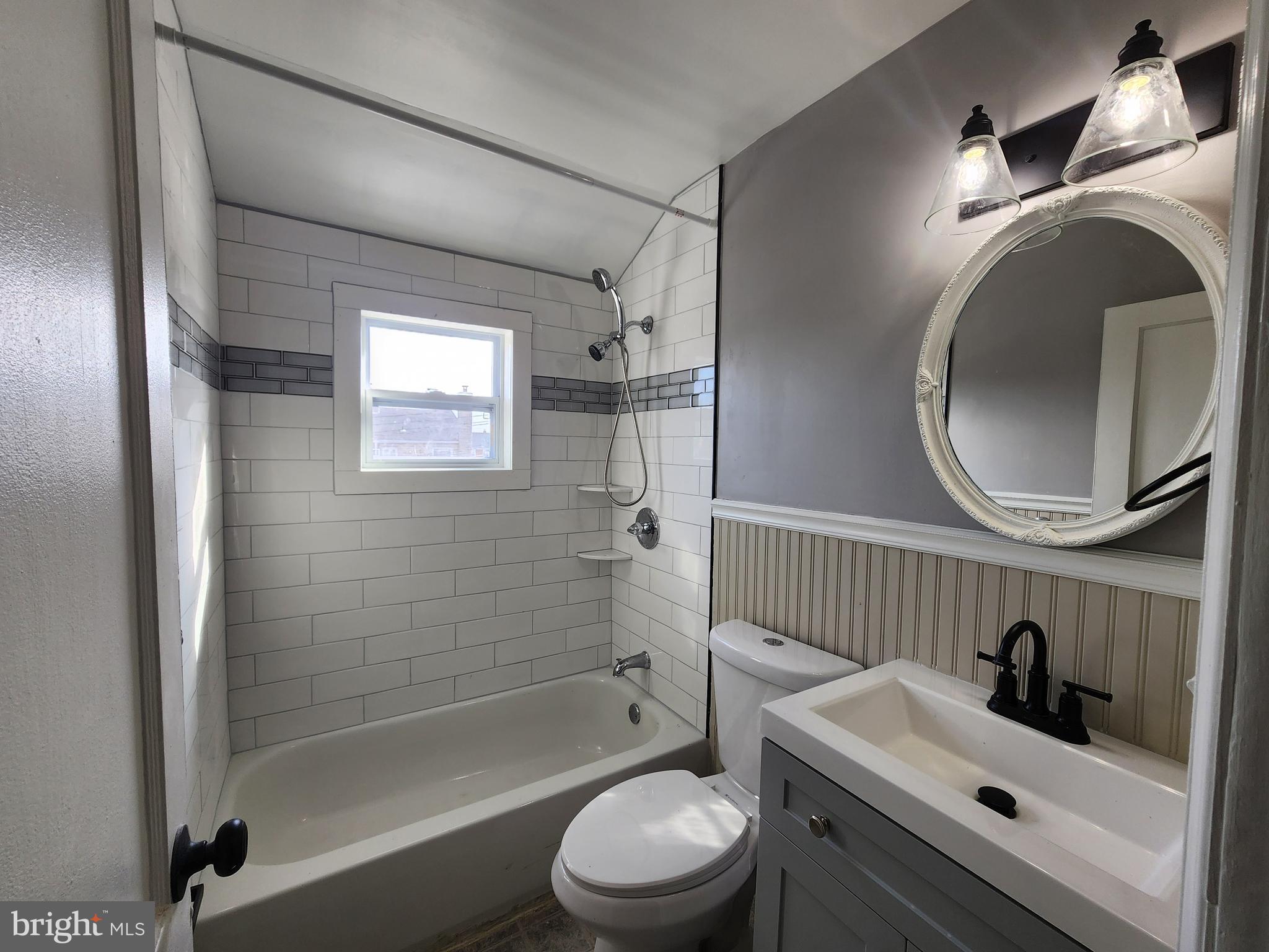 1925 Ewald Avenue Baltimore, MD 21222 - Photo 26 of 29 a bathroom with a sink toilet and shower
