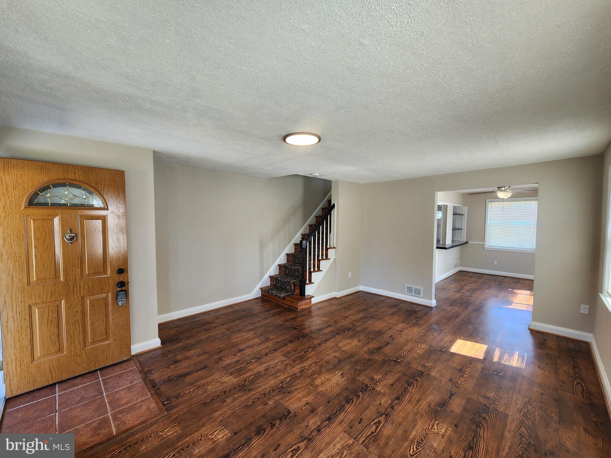 1925 Ewald Avenue Baltimore, MD 21222 - Photo 4 of 29 a view of empty room with wooden floor and fan