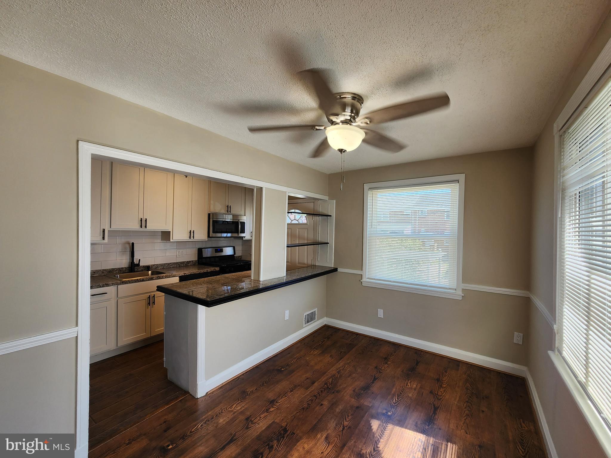 1925 Ewald Avenue Baltimore, MD 21222 - Photo 7 of 29 a kitchen with granite countertop a stove and a sink