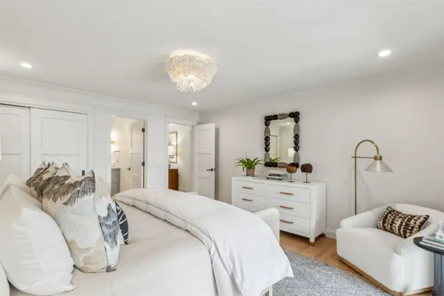 a bedroom with a bed and ceiling fan