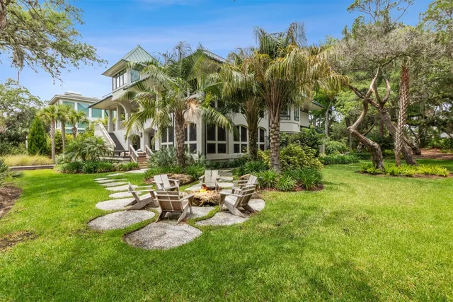 a view of a chair and tables in the garden