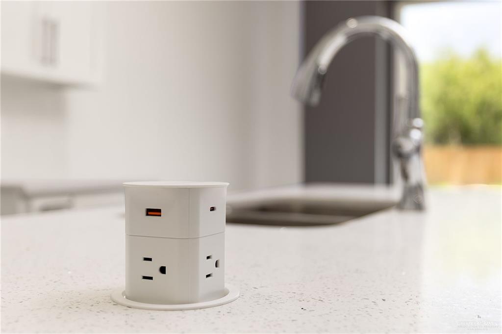 422 Reef Road Donna, TX 78537 - Photo 7 of 17 Integrated countertop power outlet featuring multiple electrical sockets and USB ports