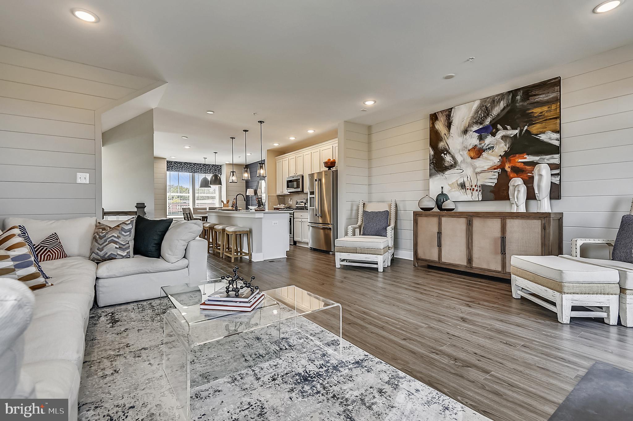 16606 Breezeway Alley Accokeek, MD 20607 - Photo 15 of 34 a living room with furniture wooden floor and white walls
