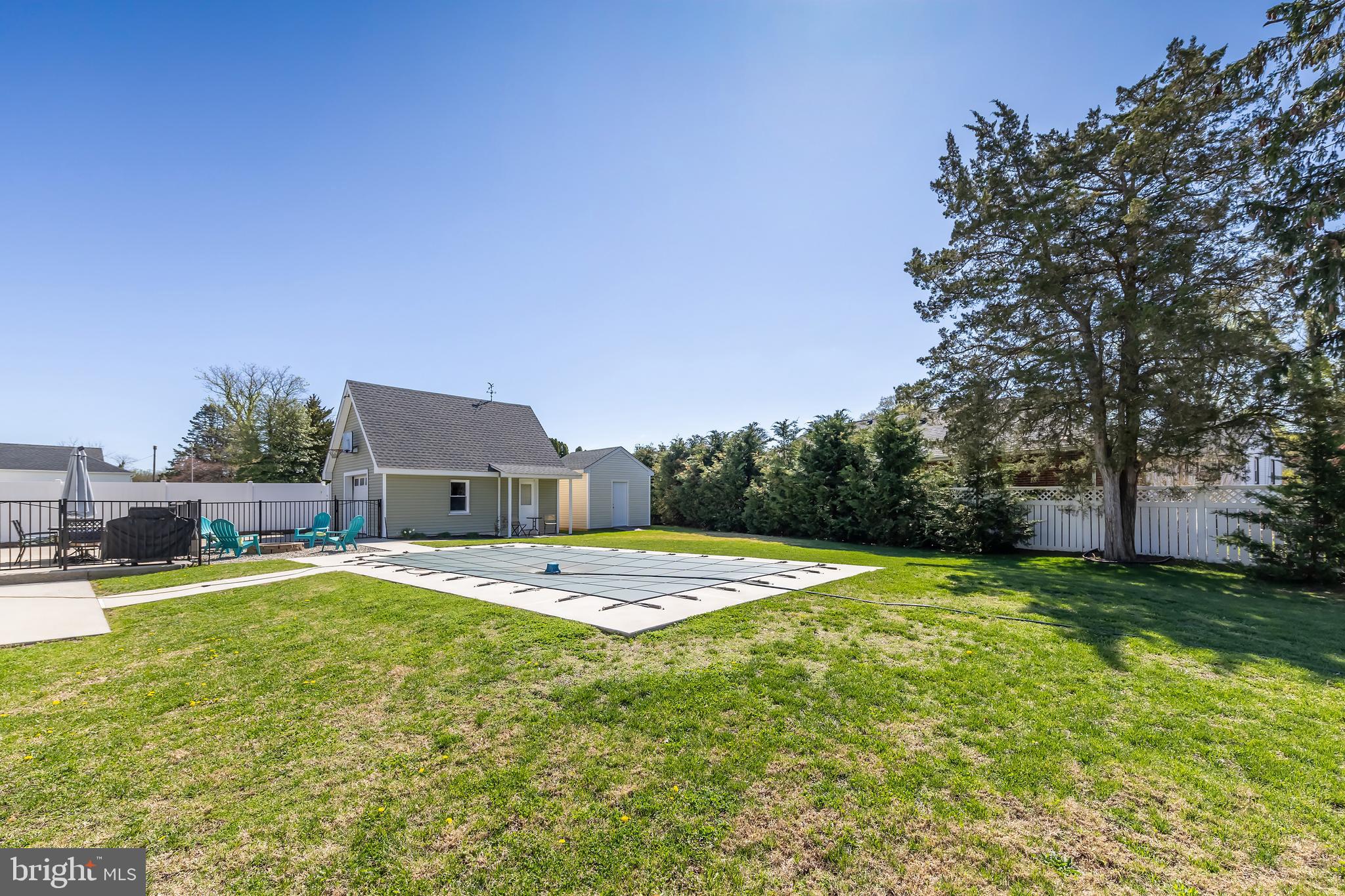 303 Main Street Mantua, NJ 08051 - Photo 32 of 50 a view of a house with swimming pool and a yard
