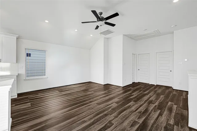 a view of room window and a ceiling fan
