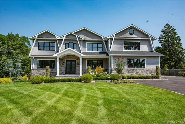 a front view of house with yard and green space