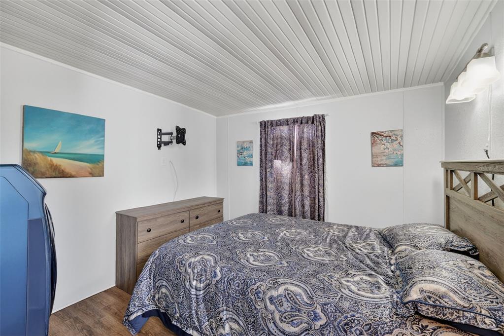 38237 Oriole Way Leesburg, FL 34788 - Photo 16 of 25 a bedroom with a bed and a window