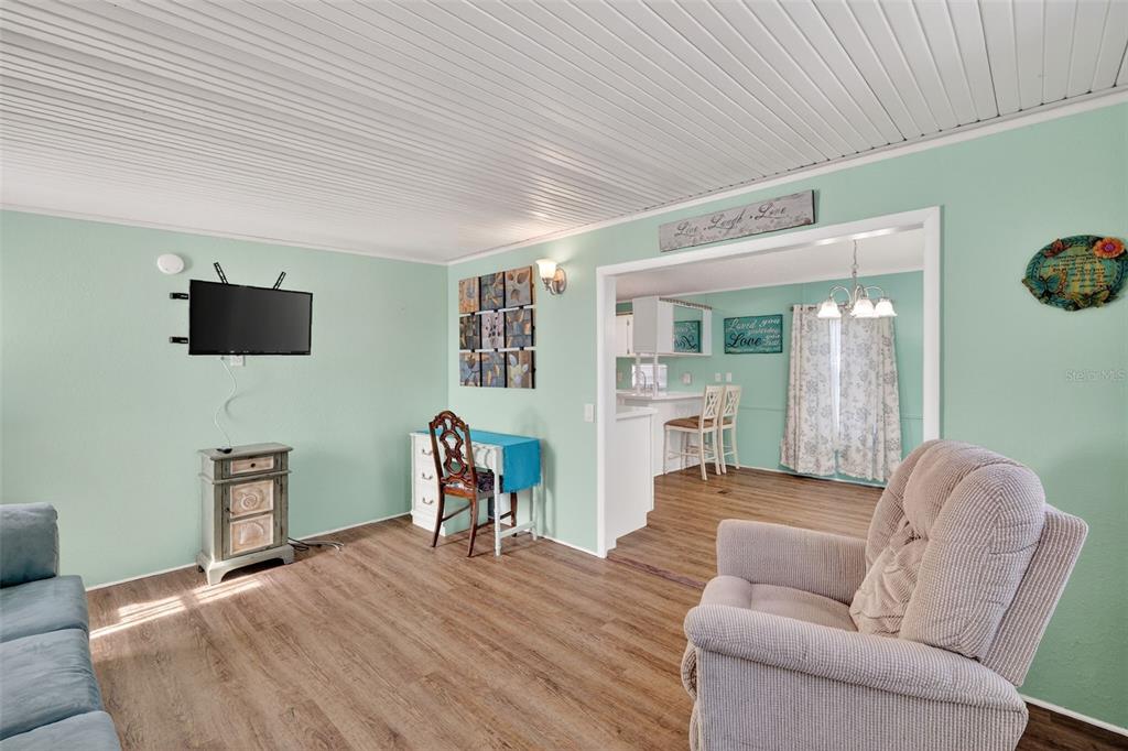 38237 Oriole Way Leesburg, FL 34788 - Photo 5 of 25 a living room with furniture and a flat screen tv