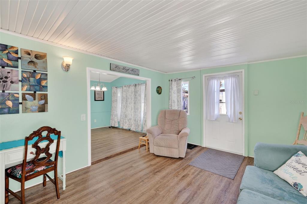 38237 Oriole Way Leesburg, FL 34788 - Photo 6 of 25 a living room with furniture and wooden floor