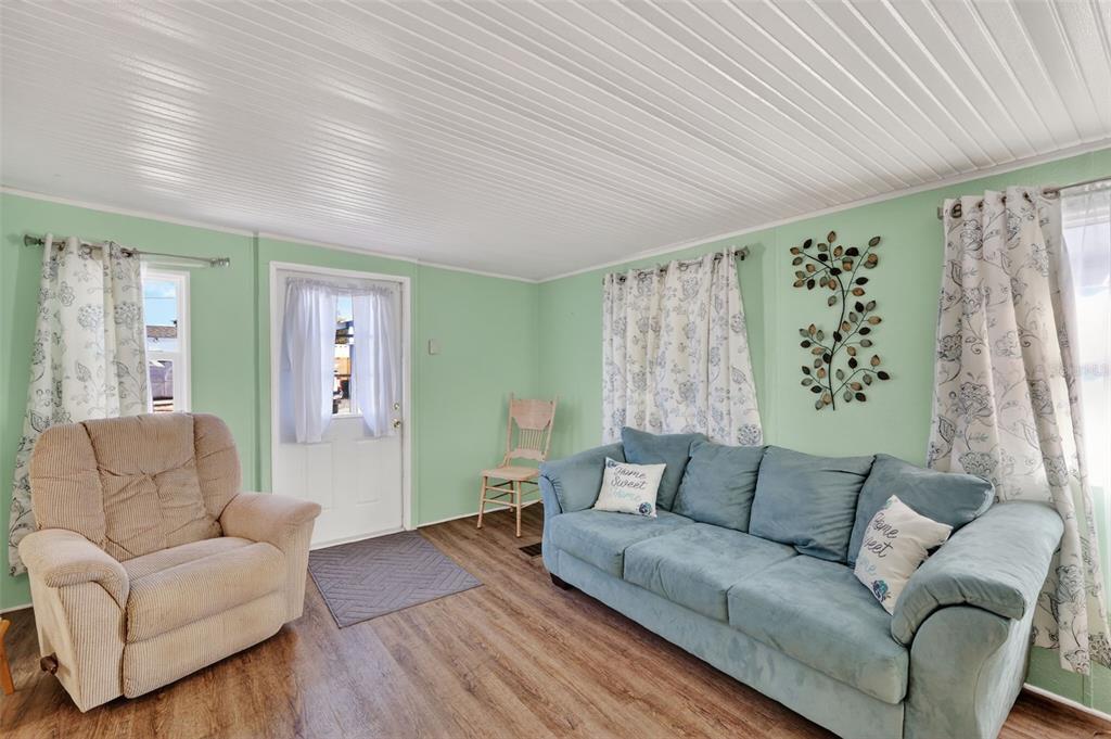 38237 Oriole Way Leesburg, FL 34788 - Photo 7 of 25 a living room with furniture and a large window