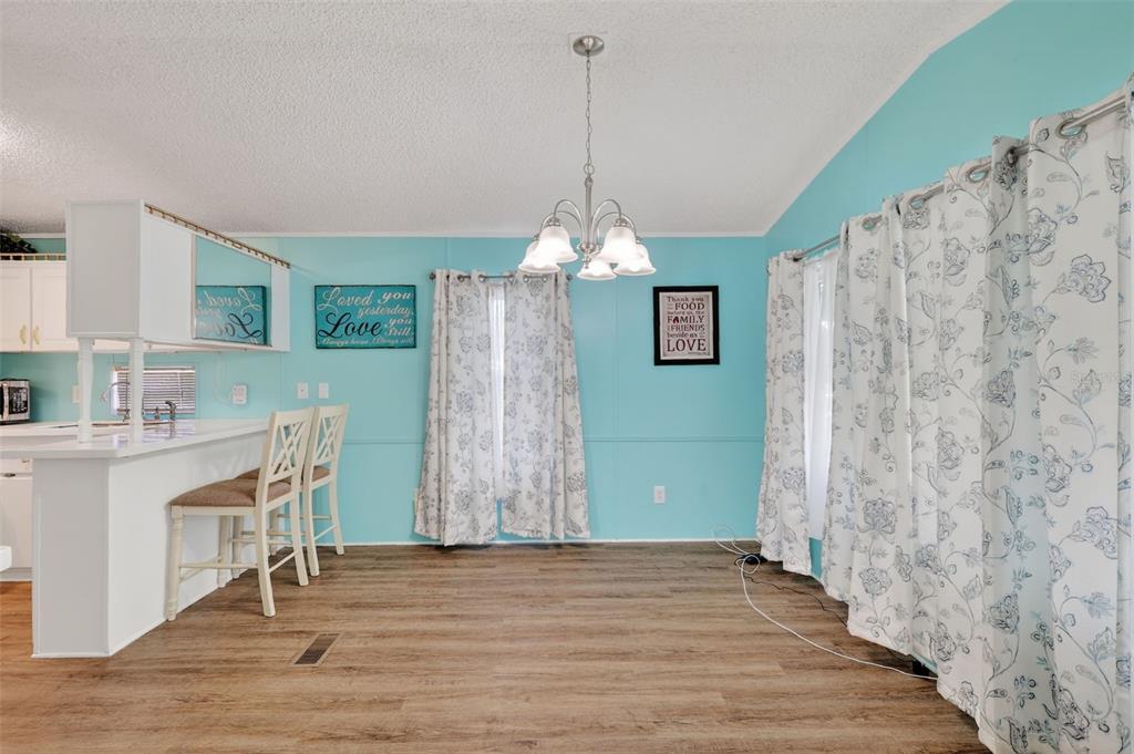 38237 Oriole Way Leesburg, FL 34788 - Photo 8 of 25 a view of a livingroom with furniture window and wooden floor