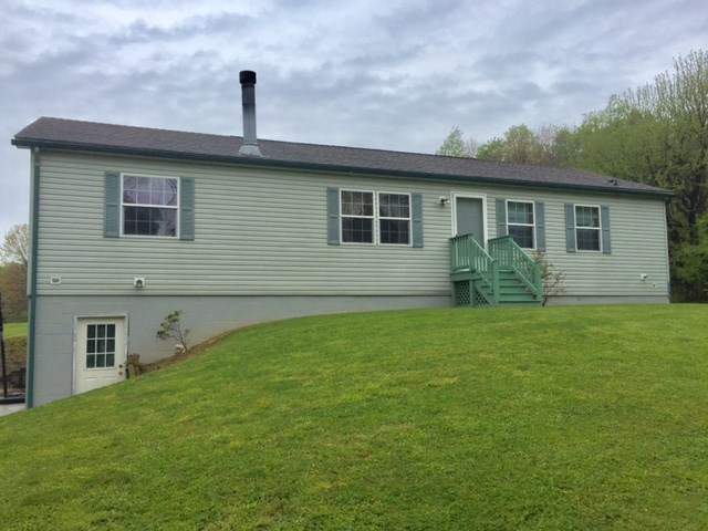 257 Stone Road Franklin, PA 16323 - Photo 1 of 1 a front view of house with yard and green space