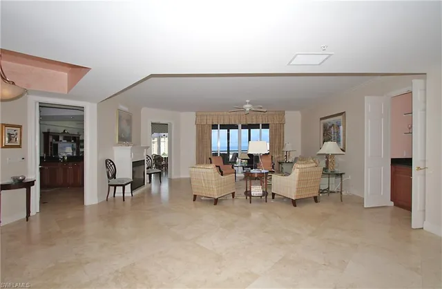 a living room with furniture and a table