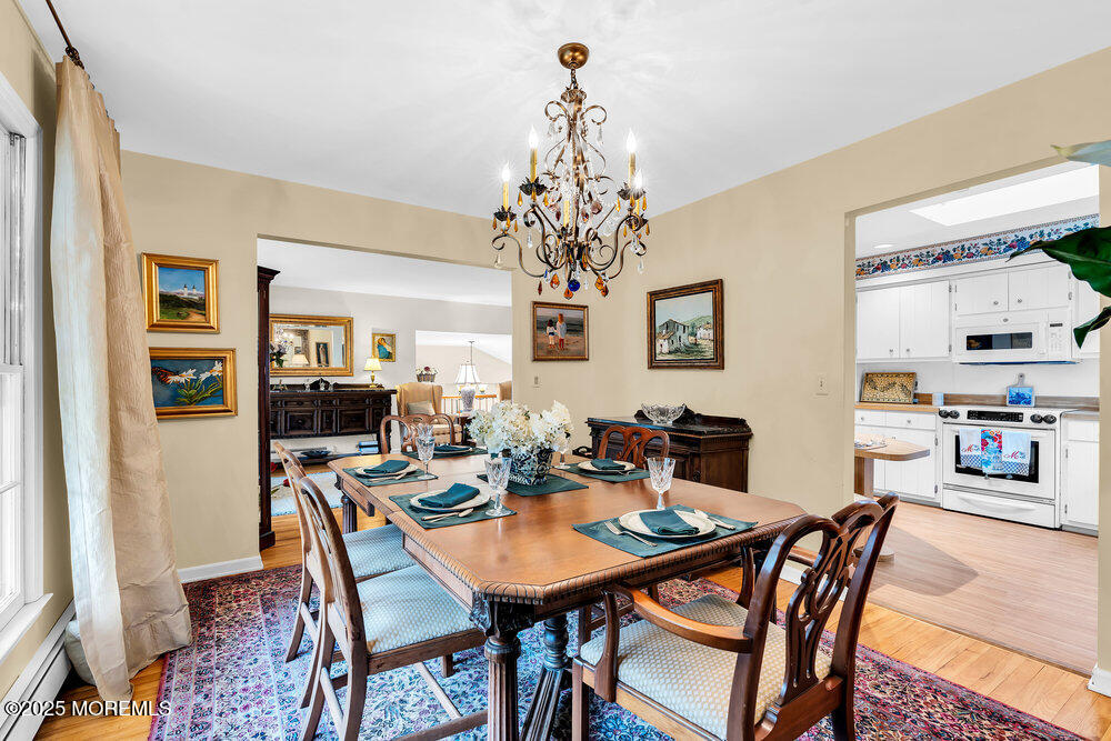 40 Brookside Lane Little Silver, NJ 07739 - Photo 11 of 43 a view of a dining room with furniture and chandelier