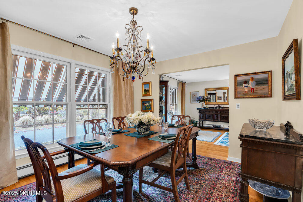 40 Brookside Lane Little Silver, NJ 07739 - Photo 12 of 43 a view of a dining room with furniture and chandelier