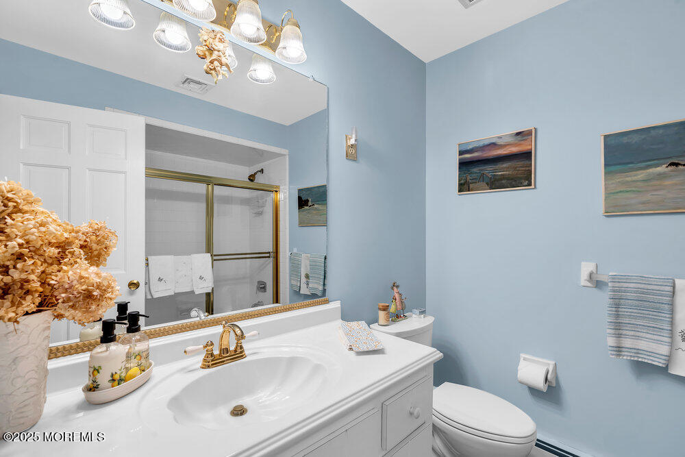 40 Brookside Lane Little Silver, NJ 07739 - Photo 15 of 43 a bathroom with a sink vanity mirror and toilet