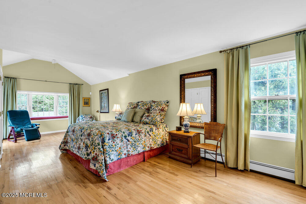 40 Brookside Lane Little Silver, NJ 07739 - Photo 16 of 43 a bedroom with a bed and a large window