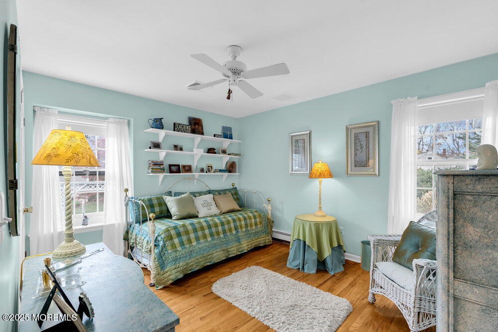 40 Brookside Lane Little Silver, NJ 07739 - Photo 21 of 43 a bedroom with furniture and a chandelier