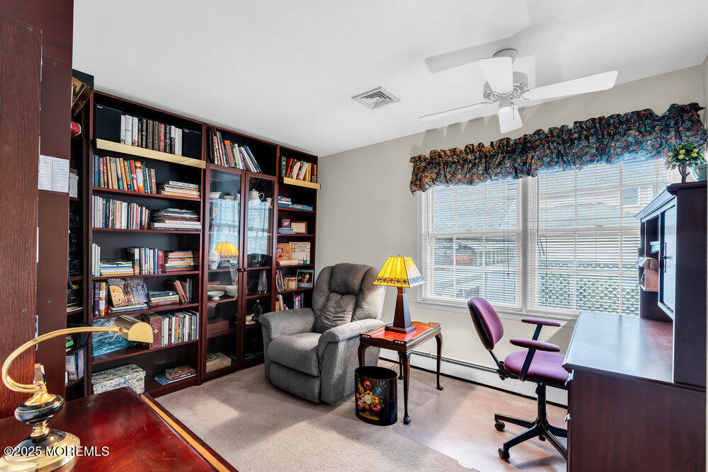 40 Brookside Lane Little Silver, NJ 07739 - Photo 22 of 43 a living room with furniture and a book shelf
