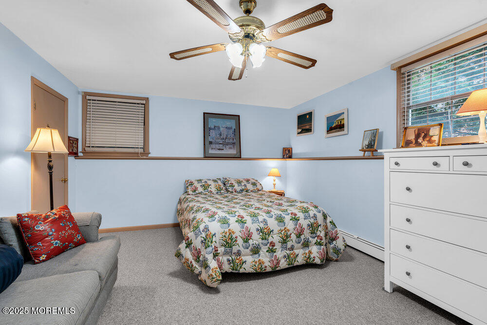 40 Brookside Lane Little Silver, NJ 07739 - Photo 28 of 43 a bedroom with a bed and ceiling fan