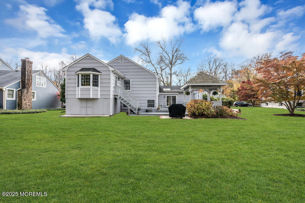 40 Brookside Lane Little Silver, NJ 07739 - Photo 35 of 43 a front view of a house with a yard