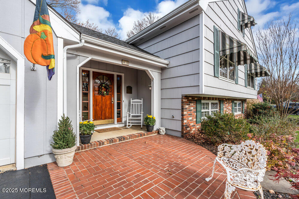 40 Brookside Lane Little Silver, NJ 07739 - Photo 4 of 43 a front view of a house with a yard