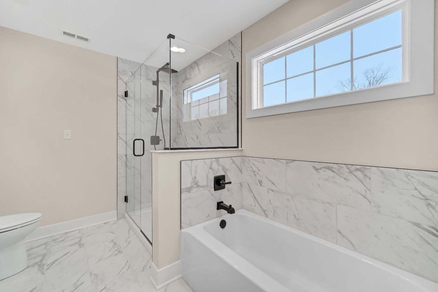 712 Verdano Terrace Crown Point, IN 46307 - Photo 16 of 24 a bathroom with a bathtub and a shower