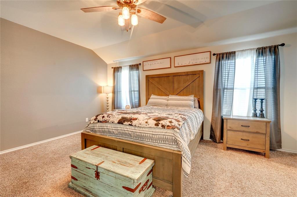 830 Rustic Way Josephine, TX 75189 - Photo 19 of 33 Bedroom featuring light carpet, lofted ceiling, and a ceiling fan