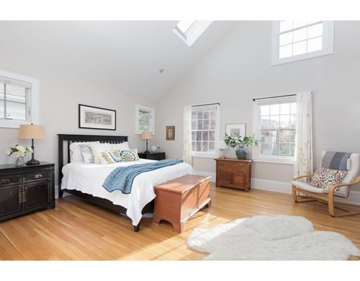 49 Grozier Road Cambridge, MA 02138 - Photo 13 of 22 a spacious bedroom with a large bed and a window