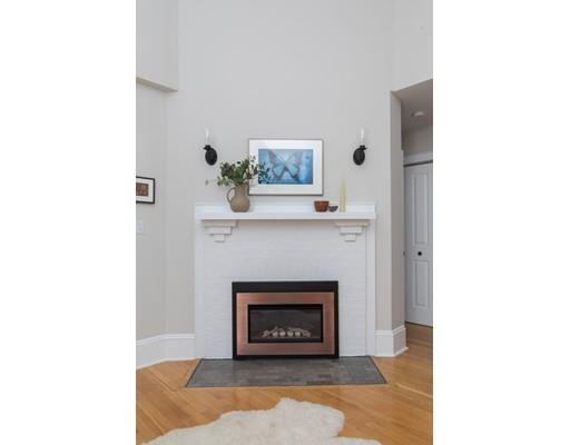 49 Grozier Road Cambridge, MA 02138 - Photo 14 of 22 a living room with a fireplace