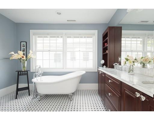 49 Grozier Road Cambridge, MA 02138 - Photo 15 of 22 a spacious bathroom with a sink a bathtub and a window