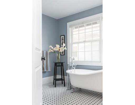 49 Grozier Road Cambridge, MA 02138 - Photo 16 of 22 a bathroom with a sink a bathtub and a toilet