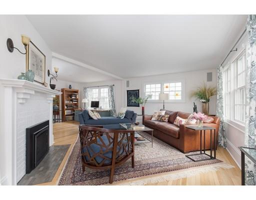 49 Grozier Road Cambridge, MA 02138 - Photo 2 of 22 a living room with furniture a fireplace and a large window