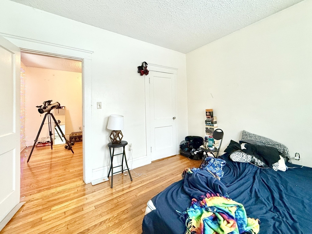 26 Chiswick Road, Unit 6 Boston, MA 02135 - Photo 12 of 24 a living room with furniture and wooden floor