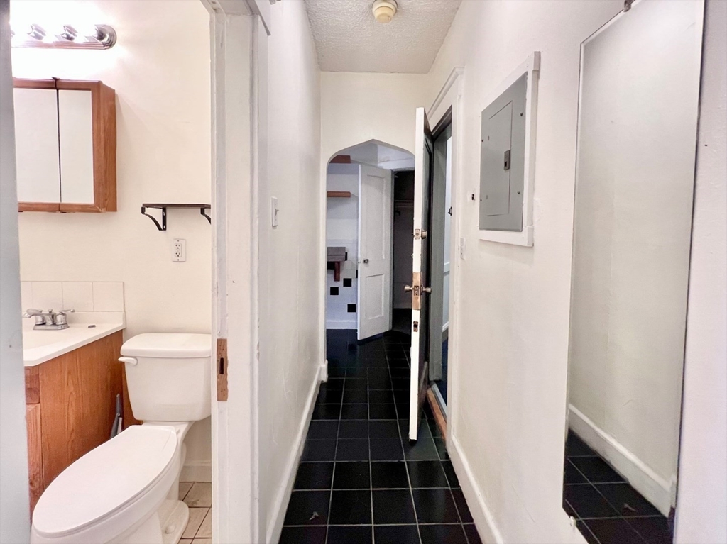 26 Chiswick Road, Unit 6 Boston, MA 02135 - Photo 5 of 24 a bathroom with a toilet and a shower