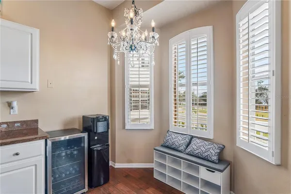a bathroom with 2 sink and a large mirror