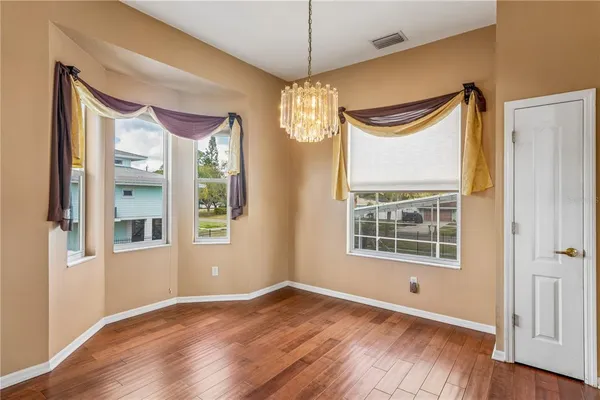 a view of an entryway with wooden floor