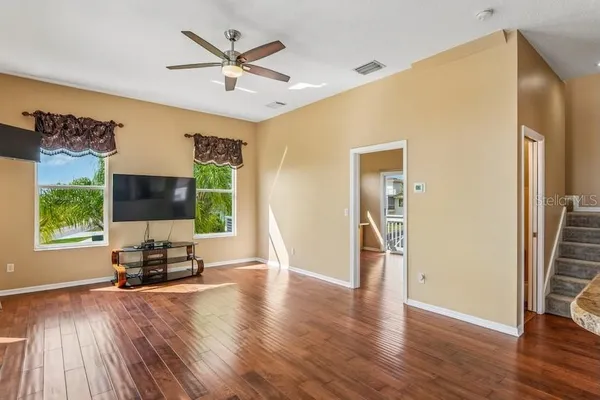 a view of an entryway with wooden floor