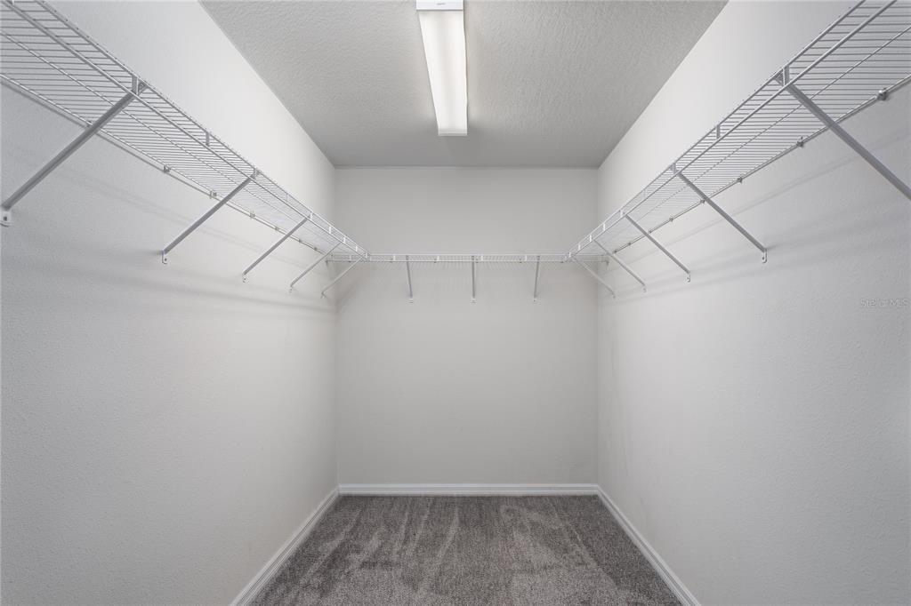 6026 100th Avenue East Parrish, FL 34219 - Photo 17 of 51 a view of a room with racks on the wall