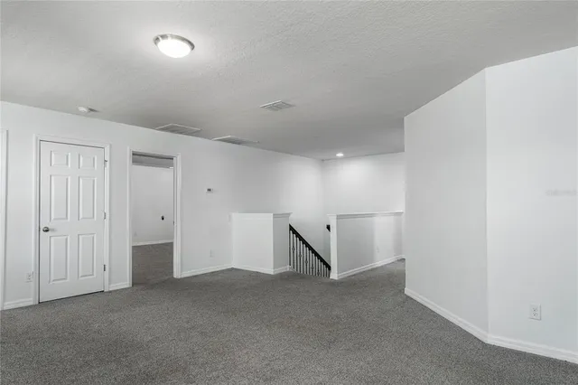 a view of room with a ceiling fan